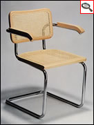 Cesca chair with armrests, seat and back in Wien straw texture, designed by Marcel Breuer.